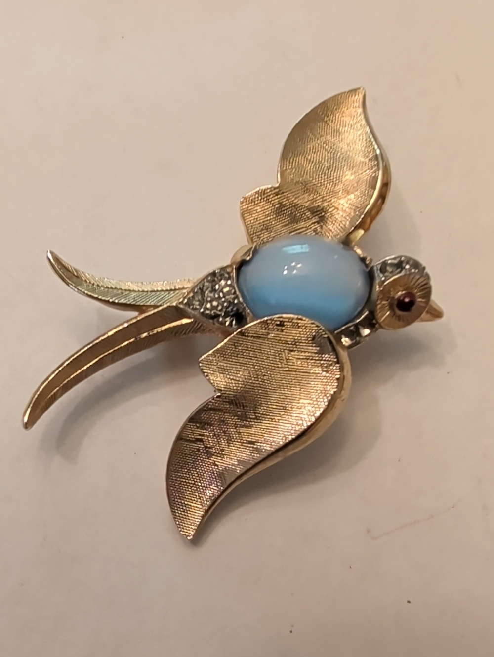Trifari Gold-Tone Bird Brooch with Pale Blue Cabochon and Red Eye